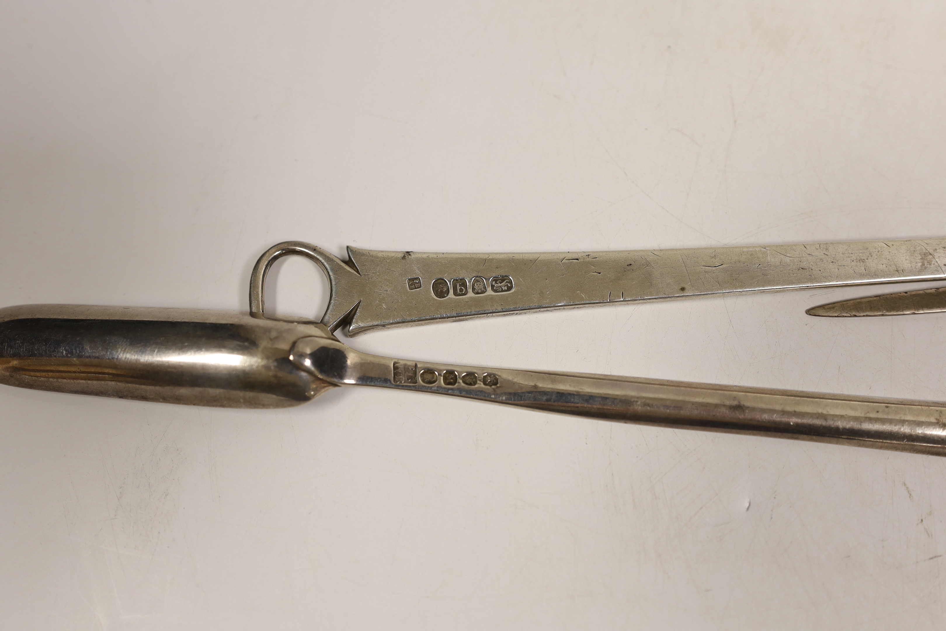 Two George III silver meat skewers by Peter & Ann Bateman, London, 1791 & 1795, largest 29.7cm and two Georgian silver marrow scoops, one by Peter & William Bateman, London, 1807.